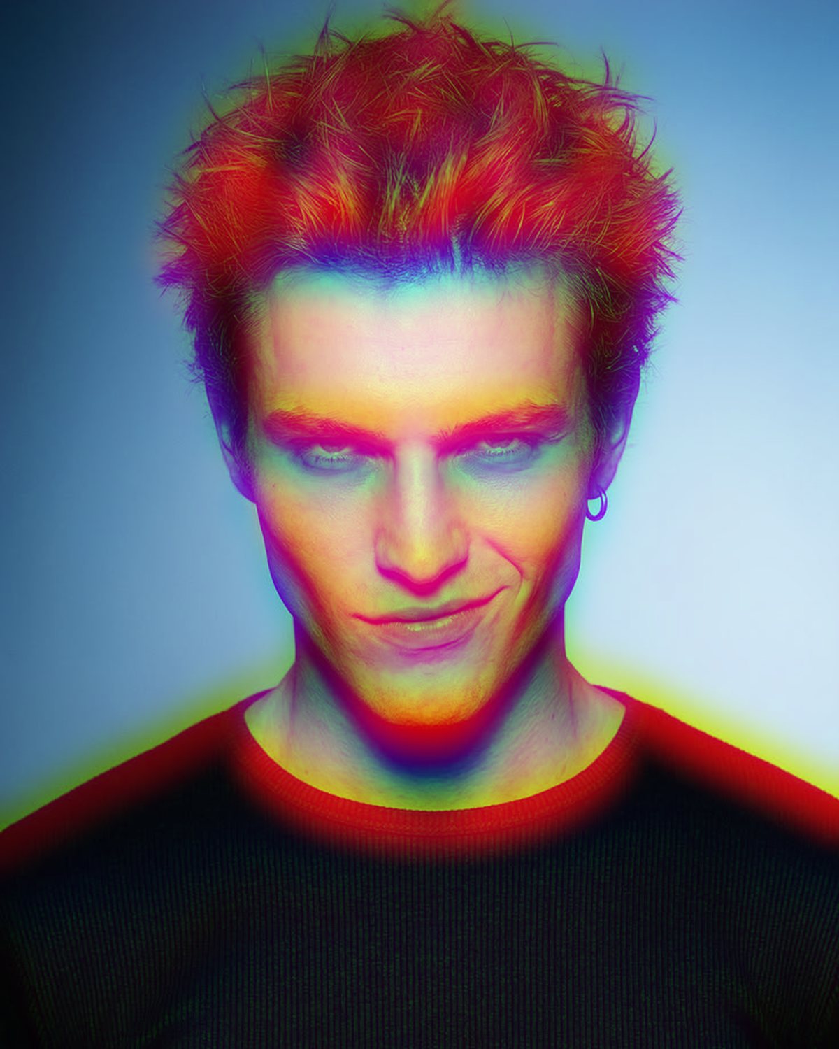Chromatic aberration effect on a portrait of a man with spiky red hair on a blue background, made with the Chromatic Aberration filter in Filter Archive (Soft Split preset)