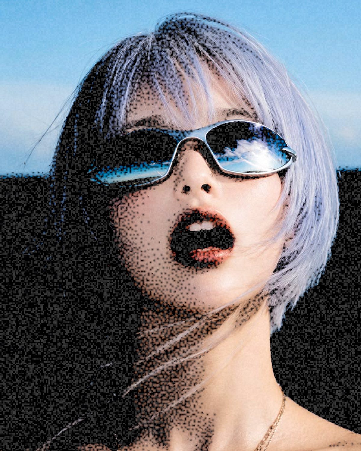 Colour photocopy effect on a portrait of a woman with silver hair and blue sunglasses by the sea, made with the Colour Threshold filter in Filter Archive (Xerox preset)