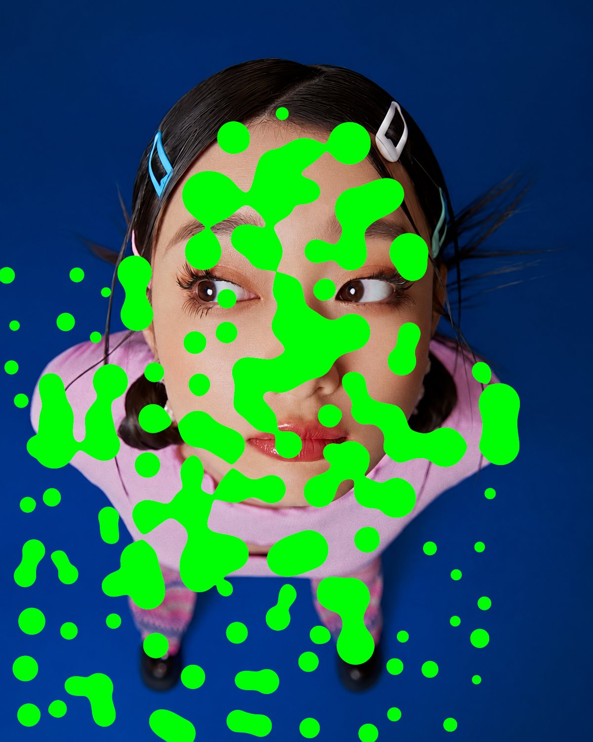 Metaball effect on a wide-angle portrait of a woman looking up at the camera, made with the Acid filter in Filter Archive (Slime preset)