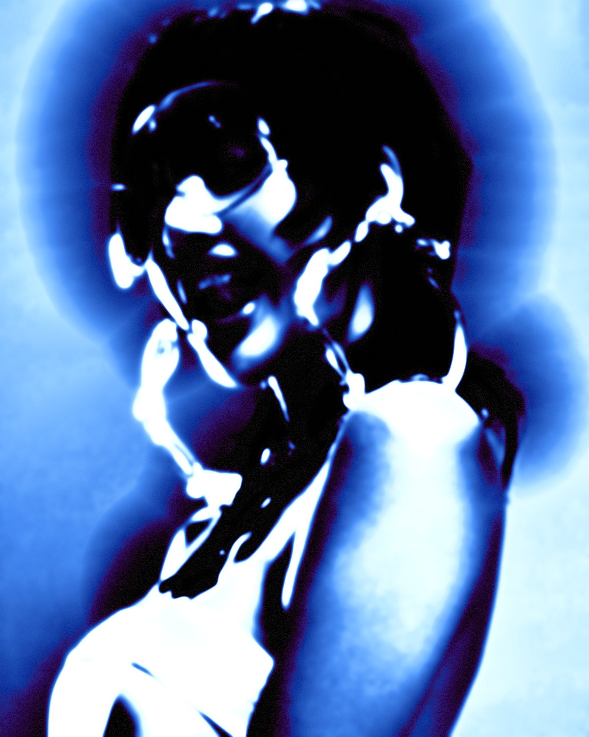 Thermal camera effect on a portrait of a woman with silver chains on a grey background, made with the Thermal filter in Filter Archive (Cold Body preset)