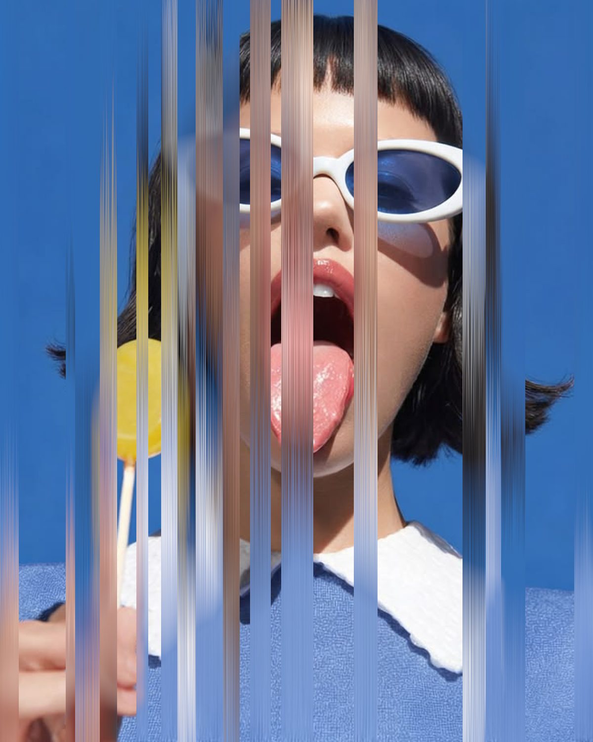 Pixel stretch effect on a portrait of a woman in white sunglasses with a lollipop, made with the Vibrate filter in Filter Archive (Torn preset)