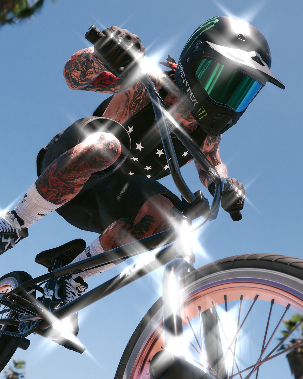 Star filter effect on a BMX rider mid-air against a blue sky, made with the Starlight filter in Filter Archive