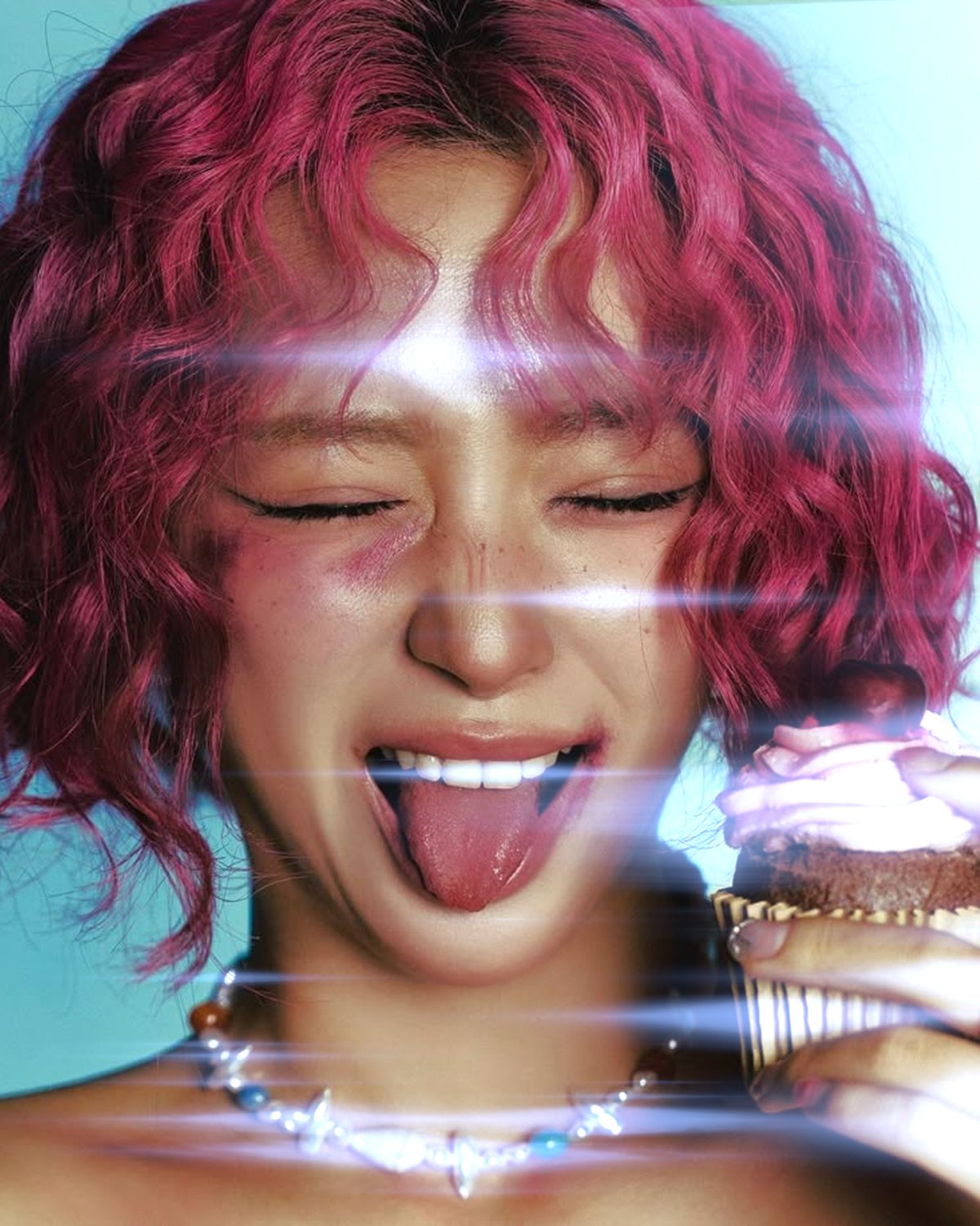 Star filter effect on a portrait of a laughing woman with pink curly hair, made with the Starlight filter in Filter Archive (Anamorphic preset)